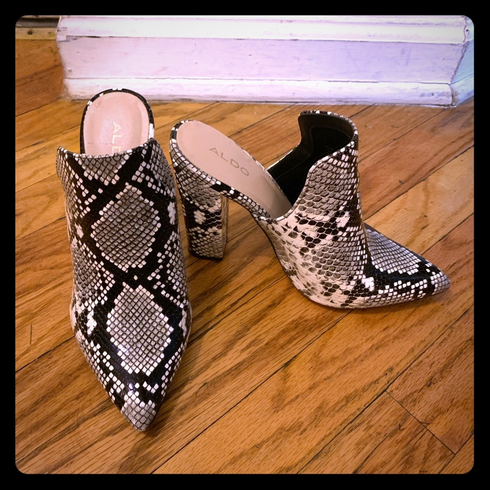 Faux snake skin mules.